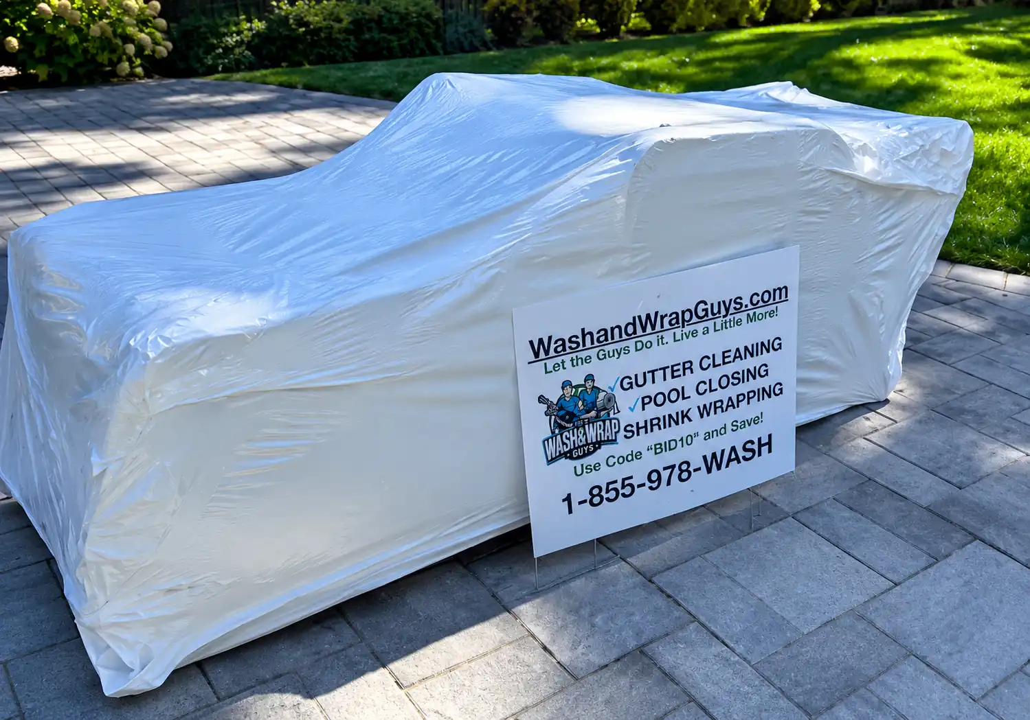 Patio furniture protected with white shrink wrap